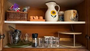 lot 443 image: Kitchen Cupboard Contents Inc Sunflower Vase, Measuring Cups, S & P, Cupcake Accessories, Lazy Susan & More