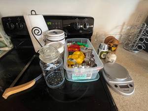 lot 445 image: Paper Towel Holder, Digital Scale, Cookie Cutters, Sugar Dispensor, Misc Jars, Bread Cutter, Etc.
