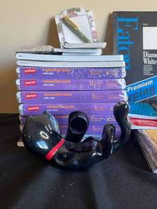 lot 115 image: Various Notebooks, Notepads, 1 magazinedocument organizer, Cat tape dispenser, Holiday Paper, Various Envelopes, Account Book, Scribble Pad, 2 staplers