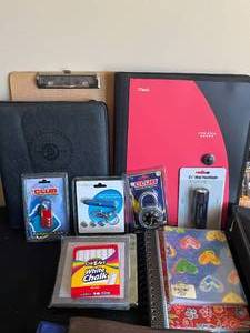 lot 129 image: Office Supplies, Various Note Pads, Binders, Sticky Notes, Trapper Keepers, Locks, Small Sunflower Desk Clocks, etc.