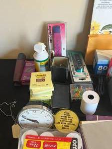 lot 130 image: Home Office Supplies - Staplers, Envelopes, Command Hooks, Drawer Organizer, Duster, Decorative Computer Paper, Sticky Notes, Folders, Decor Stencil, Paper Weight, Electric Pencil Sharpener (untested), Desk Clock (untested), etc.