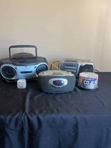 lot 136 image: 3 Various Boomboxes (one missing power cord), Unbranded MP3 Player, Blank CDs - all untested