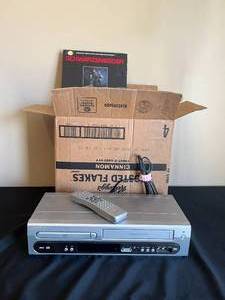 lot 142 image: Magnavox Combo VHSDVD Player with Remote (untested), Box of Various VHS Tapes