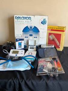 lot 162 image: Lot of Misc. HealthWellnessSafety Items - Massaging Foot Bath, Heat Massager, Fitbit Flex 2, Blood Pressure Cuff, Car Cane, Digital Clocks, etc.