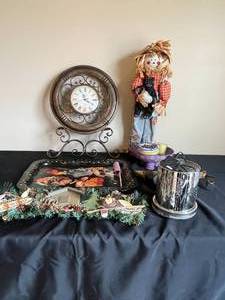 lot 175 image: Various Home Decor- Wall Clock (battery operated and untested), Tray, Scarecrow, Cabin Fever Sign, Homes for Sale Birdhouse Sign, Pedestal Bowl, Candles, Marbles, Silver Light Up Firework Decor (untested)