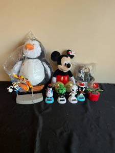 lot 186 image: Solar Bobble Head Figurines, Mickey Mouse, Penguin and Pilot Bear Stuffed Animals, and Hong Kong Phooey Figurine.