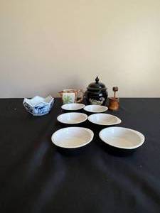 lot 219 image: 6 Saucers, 1 Black Jar, 1 Blue and White Bowl, 1 Toothpick Holder and 1 Creamer