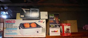 lot 472 image: Lot of Small Household Appliances Inc Nutri Ninja, Nesco 18 QT Roaster Oven, Anchor Ovenware Microware & More