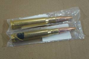 lot 77 image: .50 Cal Bullet Casing Bottle Opener and Tap Handle
