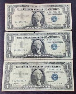 lot 28 image: (3) 1957 Silver Certificate $1 Notes