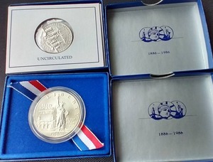 lot 33 image: 1986 Uncirculated Liberty Coins - Dollar & Half Dollar