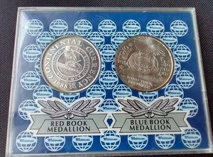 lot 37 image: (2) 1988 Whitman 1 oz. Silver Rounds - Red Book & Blue Book