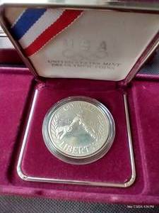 lot 104 image: 1988 U.S. Mint Proof Olympic Dollar