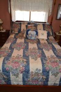 Vintage Bedframe and Floral Pattern Bedding, with Pillows