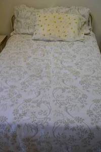 8 - Vintage Bedframe with Leaf Pattern Bedding
