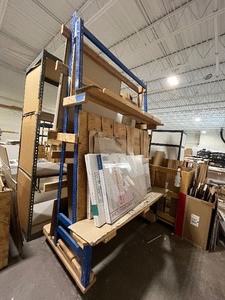 Double-sided Rolling Shelving Unit as pictured. Measures approx 70 W X 42 D X 108 H. On Wheels