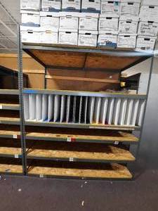 Metal Storage Rack with 34 Plywood shelves. shelves and vertical dividers on one level. Measures 97 L x 48 D X 120 H