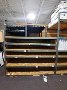 Metal Storage Rack with 34 Plywood shelves. Measures 96.5 L x 48 d x 120 H.