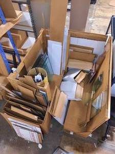 Bins of materials Clear Glass Sheets, Kraft backing paper sheets, foam core various sizes and corrugated sheets various sizes