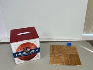 Flooring signed by Bradley Beal Florida BallQube basketball display case.