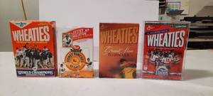 (4) Unopened Cereal Boxes featuring Sports Legends. Wheaties USA Hockey Twins Grand Slam Tiger Woods Post HOF Baseball Cards