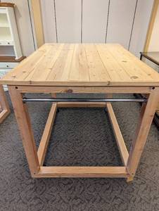 Natural Wood framed box style retail display with slatted shelf top and casters for ease of portability.
