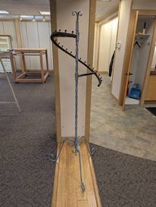 Wrought-iron coat rack style cascading retail display