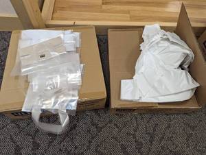 Full and near full cases of 18 x 10 x 30 .65mil white t-shirt bags