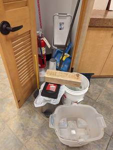 Content of closet including garbage Bins, cleaning tools and other supplies
