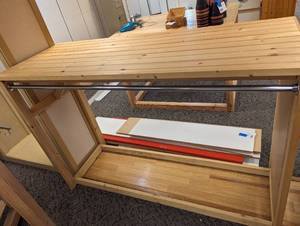 Heavy duty Wood framed retail display with slatted shelf top and end for additional usage space