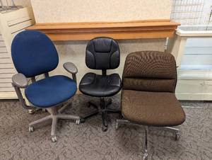 Trio of rolling office chairs