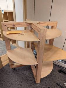 Heavy duty Wood framed multi-feature retail display with half circle shelving, rod and hook style hangers and wheels for ease of portability
