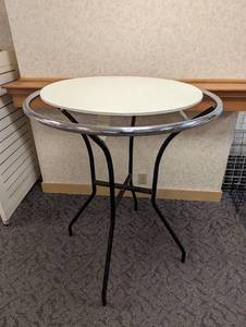 Metal framed round and crossbar retail display unit with wood floating style shelf approximately 30