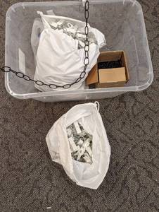 Storage tote of assorted chain and hanger style retail display accessories