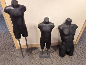 Pair of boy torso and thigh display mannequins and single male torso and thigh display mannequin