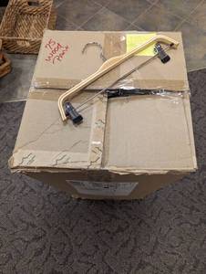 Large box of wood pant hangers