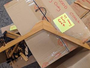 Large box of heavy duty wood coat hangers and Patagonia wood pant hangers