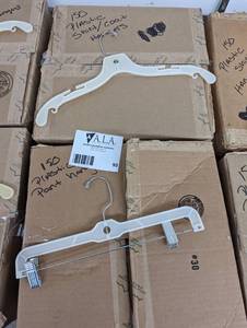 (2) large boxes of assorted plastic pant and shirtcoat hangers
