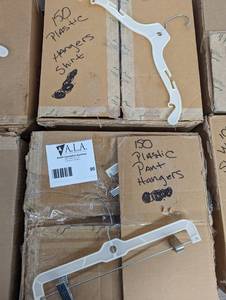 (2) large boxes of assorted pant and shirtcoat hangers