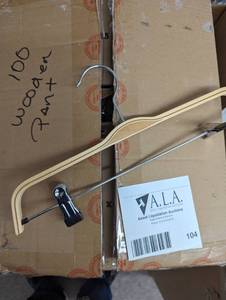 Large box of wood pant hangers