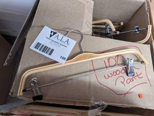 Large box of wood pant hangers