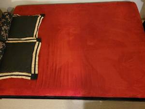 lot 40 image: Elegant Wooden Woven Futon with Red Mattress and Pillows