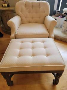 lot 102 image: Elegant Beige Upholstered Armchair and Ottoman Set