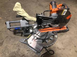 RIDGID 15 Amp Corded 12 in. Dual Bevel Sliding Miter Saw with 70 Deg. Miter Capacity and LED Cut Line IndicatorCustomer Returns See Pictures