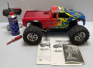 lot 91 image: Vintage Mammoth XTM Gas Powered RC Truck With Extras