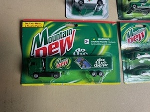 lot 30 image: 7UP and Moutain Dew Die Cast Cars - New in Package