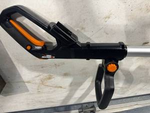 lot 53 image: Worx Trimmer and Fiskars Lopper