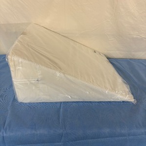 lot 109 image: MSRP $80  1 NEW Global 117-2520 10 x 24 x 24 Standard Smooth Top Bed Wedge with Cover - White