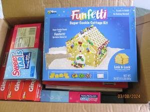 box of candy and gingerbread house in date Best by 022025