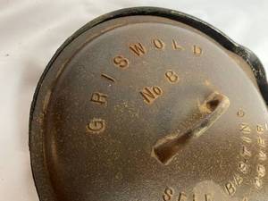 lot 296 image: Griswold Cast Iron No. 8 Skillet and Cover